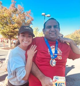 Prakhar smiles with a teacher