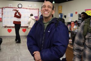 Steven, smiling, gets ready to head to work at Wawa.