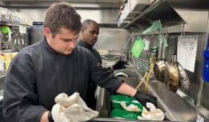 Zach and Hassan help prepare Salt Creek Grille for opening