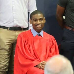 Bryce smiles during commencement. 