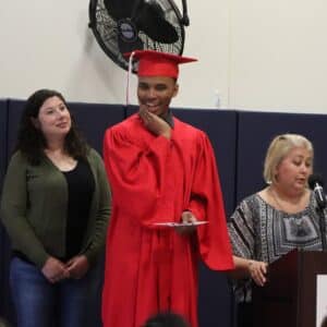 Marquis smiles while receiving his diploma 